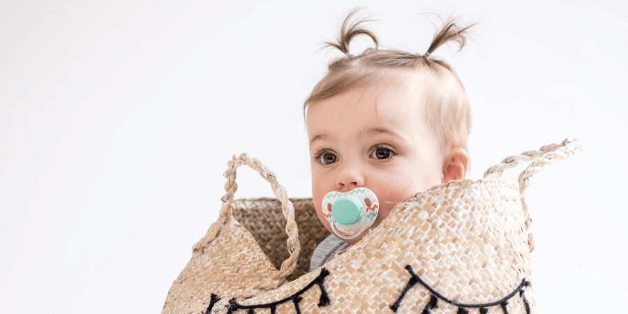 Cute baby in a basket