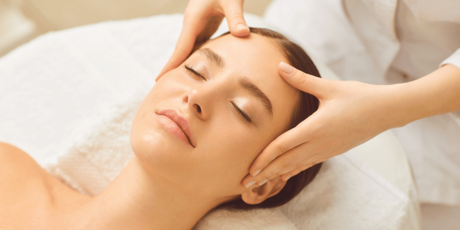 Woman receiving a face massage